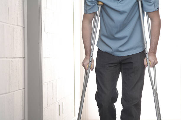 man with crutches